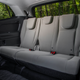 Third row with the headrests down, where they will poke your back in an uncomfortable way.